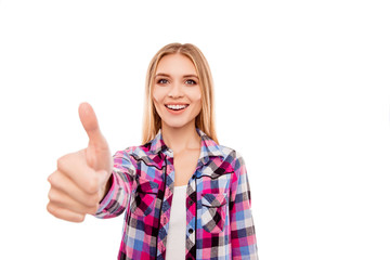 Happy young smiling girl gesturing and showing thumb up