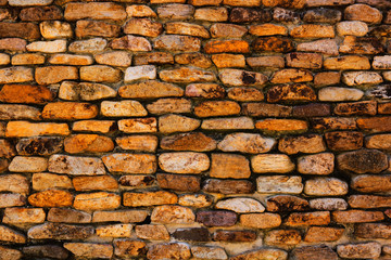 background and texture of granite stone wall surface.