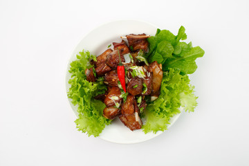 ribs in lettuce on a white background