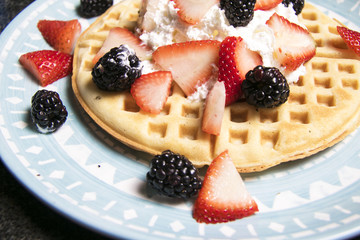 Waffle with strawberries and blackberries