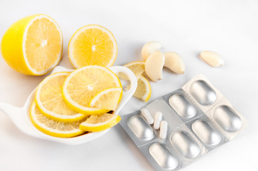 Lemon, garlic and drugs against influenza on a white background