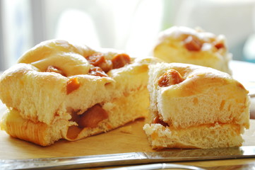 bread topping slice pork sausage cut for piece on wooden chop plate