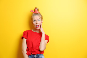Young cool woman on yellow background
