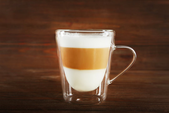 Cup of coffee on wooden background