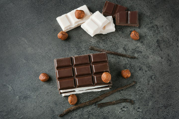 Black and white chocolate on gray background