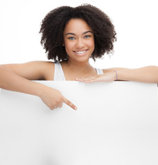 Young Smileing teenager african girl hold black blank paper and shows on it.