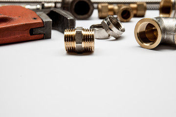 plumbing tools and equipment on white background with copy space