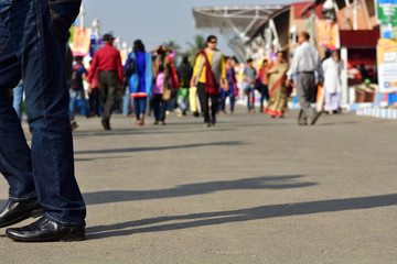 Motion blurred pedestrians are walking