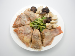 Steamed tilapia fish.