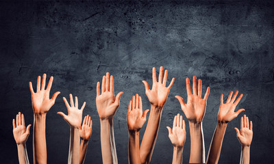 Group of people rise hands . Mixed media