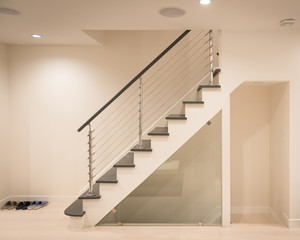 Modern staircase and hand rail design in white and grey color