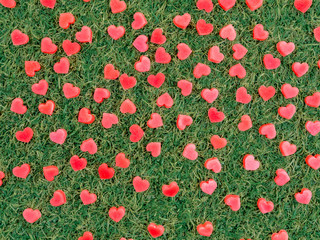 heart shape made from candle on artificial grass