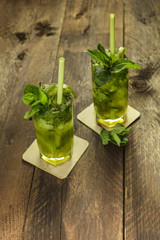 Mojito cocktails with mint leaves and lime
