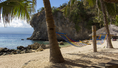 The hammocks and views of tropical beach. Apo island, Philippines.