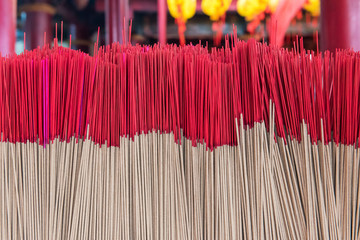 Red incense sticks. Materials used in asia religion culture