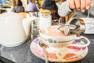 hot milk tea in ceramic cup in cafe