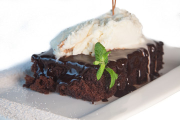 Chocolate pie with icecream isolated on white