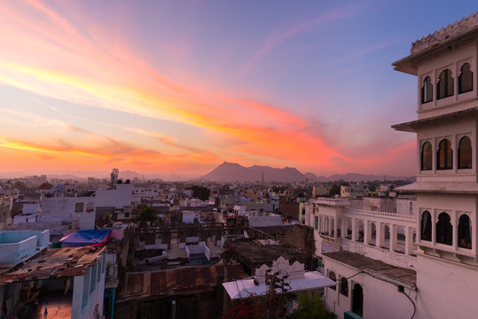 Udaipur cityscape with colorful sky at sunset, travel destination in Rajasthan, India
