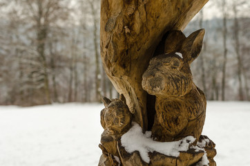 Carved rabbit in old tree
