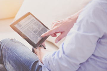 Pleasant man using tablet