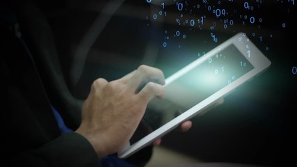 Businessman using tablet with Binary Code explode from screen - Powered by Adobe