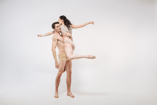 Professional ballet dancers performing in the white room