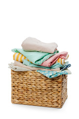 Clothes in a laundry wooden basket isolated on white background