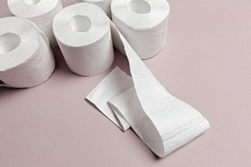 Toilet paper on pink background