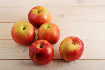 Naklejka na ściany i meble red ripe apples on wooden white background