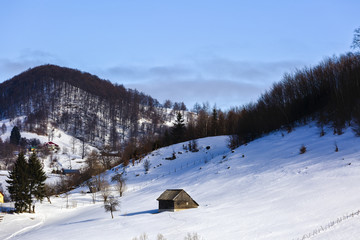 winter landscape with a mountain village in Romania