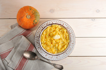 pumpkin porridge with butter and a pumpkin