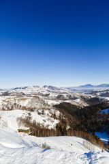 winter landscape with a mountain village in Romania