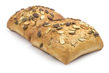 Rustic, organic bread with pumpkin seeds. Clipping path included in JPEG.