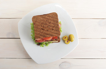 sandwich with chicken and bacon on plate