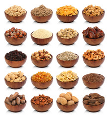 Collection of healthy dried fruits, cereals, seeds and nuts isolated on white background. Large...