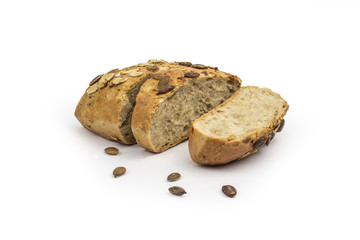 Rustic, organic bread with pumpkin seeds. Clipping path included in JPEG.