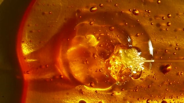 honey texture with bubbles on a gold background