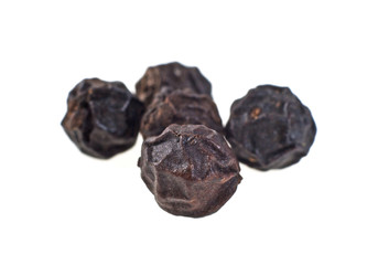 Close up of a peppercorns. Macro image, selective focus.