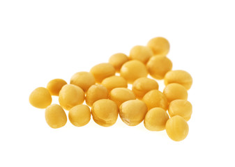 Macro closeup of organic yellow mustard seeds isolated on white