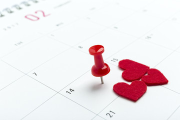 Valentines day on calendar with red pin.