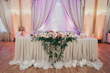 beautifully decorated hall of the restaurant for wedding celebra