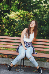 young beautiful girl walking park