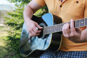 guitar string man hand outdoor