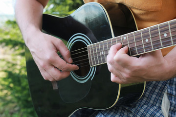 Fototapeta na wymiar guitar string man hand outdoor