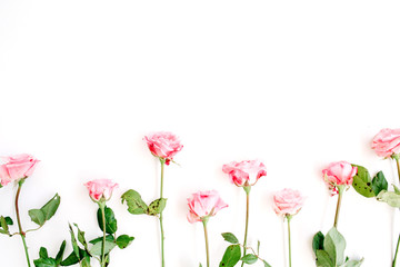 Pink roses on white background. Flat lay, top view. Valentine's background