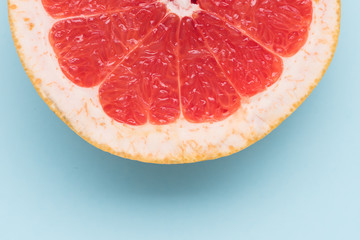Orange grapefruit close up on blue