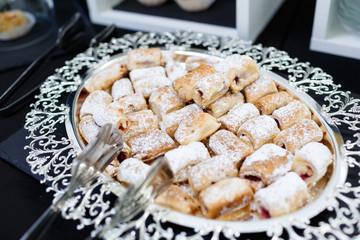 Tasty cookies on beautiful silver tray
