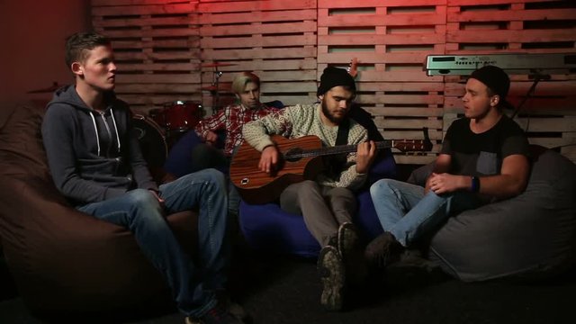 Music band rehearsing in the garage