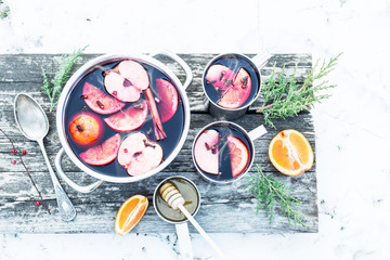 Christmas - hot mulled wine outdoor in a pot with snow around