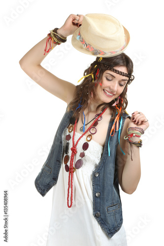 “Happy hippie girl holding a stylish hat isolated on a white background